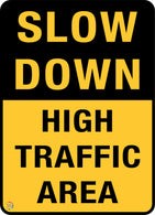 Slow Down High Traffic Area Sign