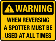 Warning<br/> When Reversing A Spotter<br/> Must Be Used At All Times